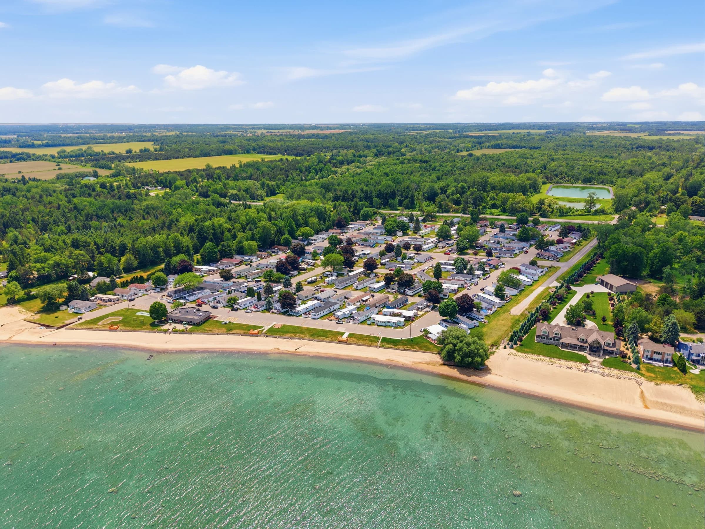 Aerial overview of Huron Shores and its sandy Lake Huron shoreline