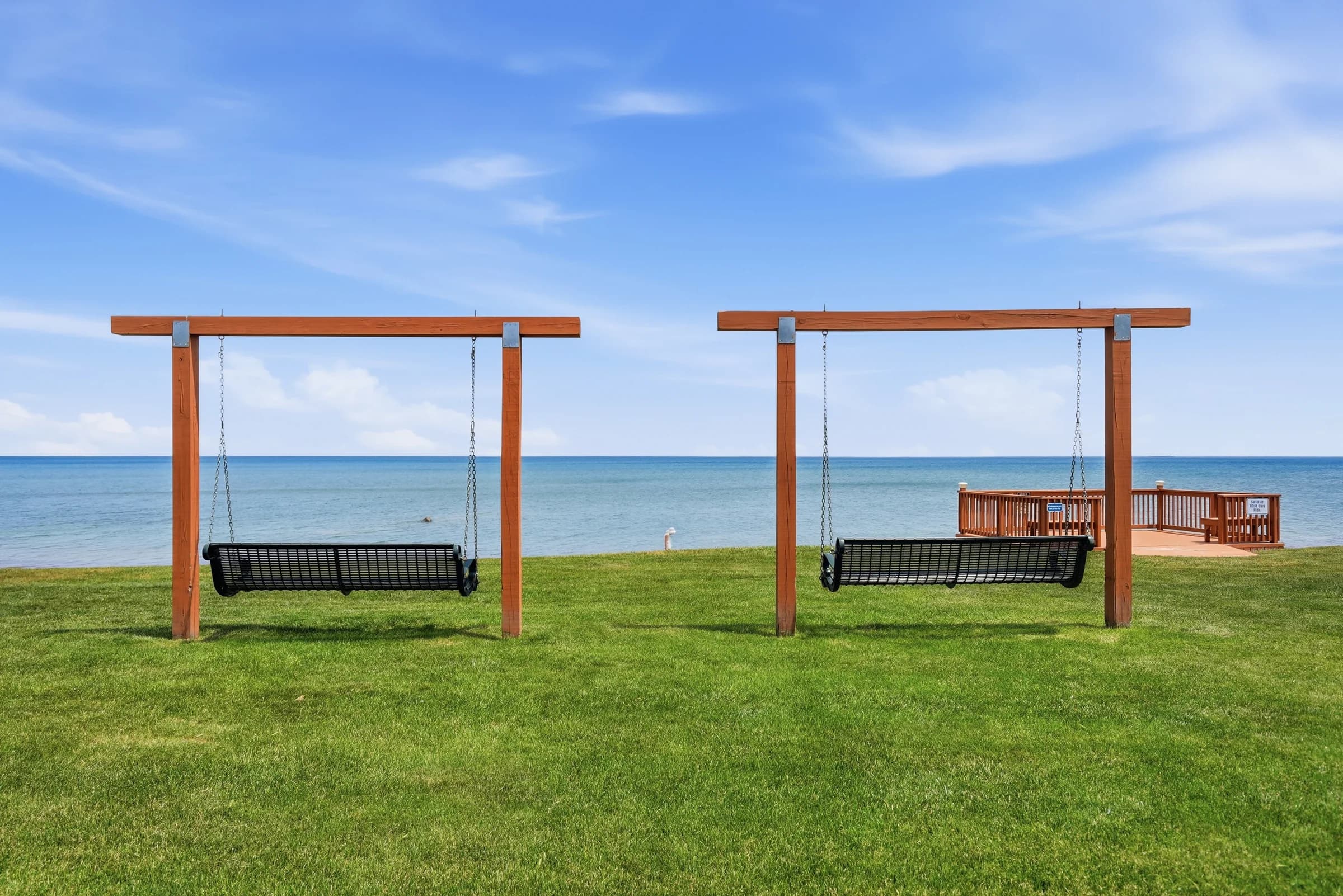 Lakefront swings overlooking Lake Huron at Huron Shores
