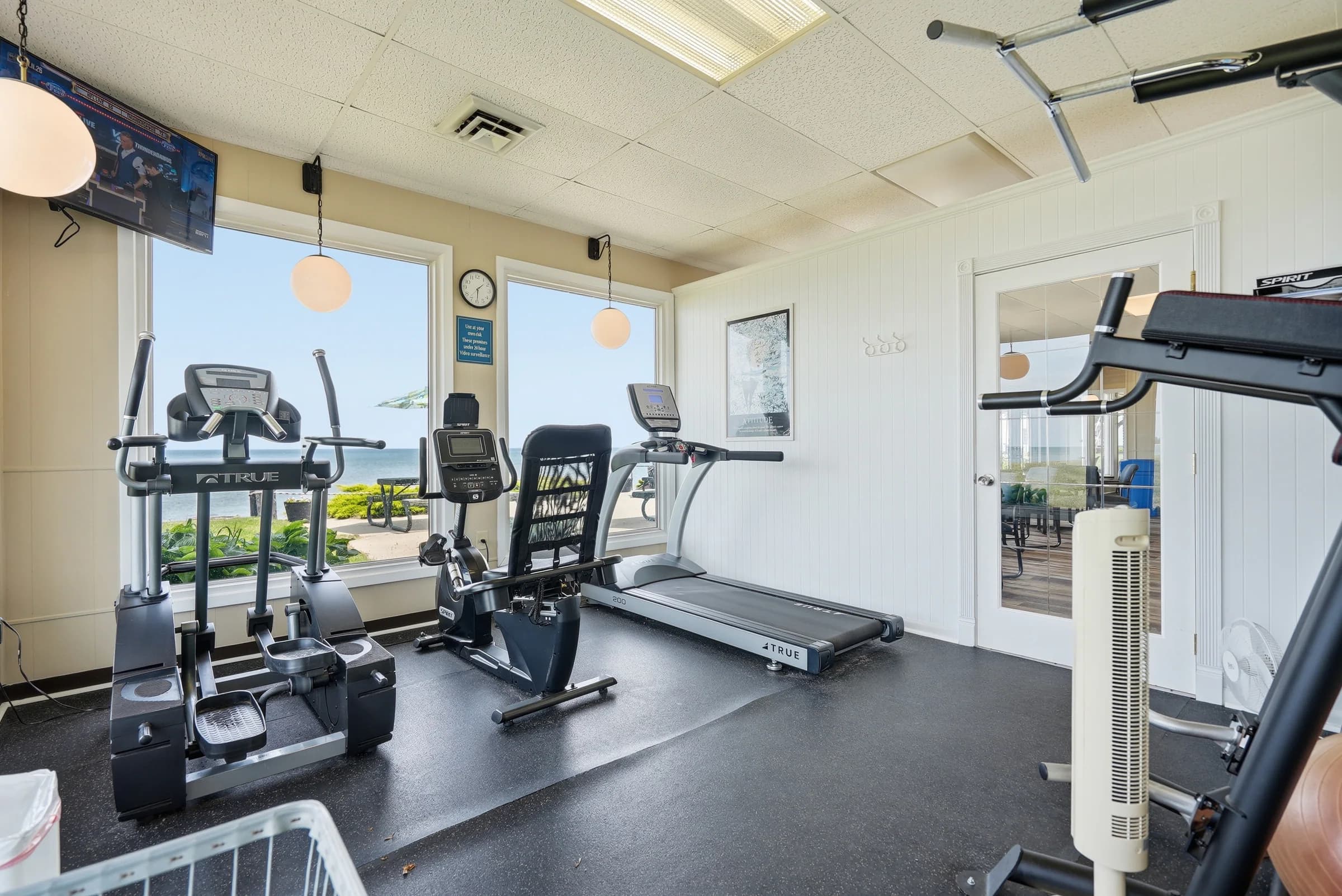 Resident fitness room overlooking Lake Huron at Huron Shores
