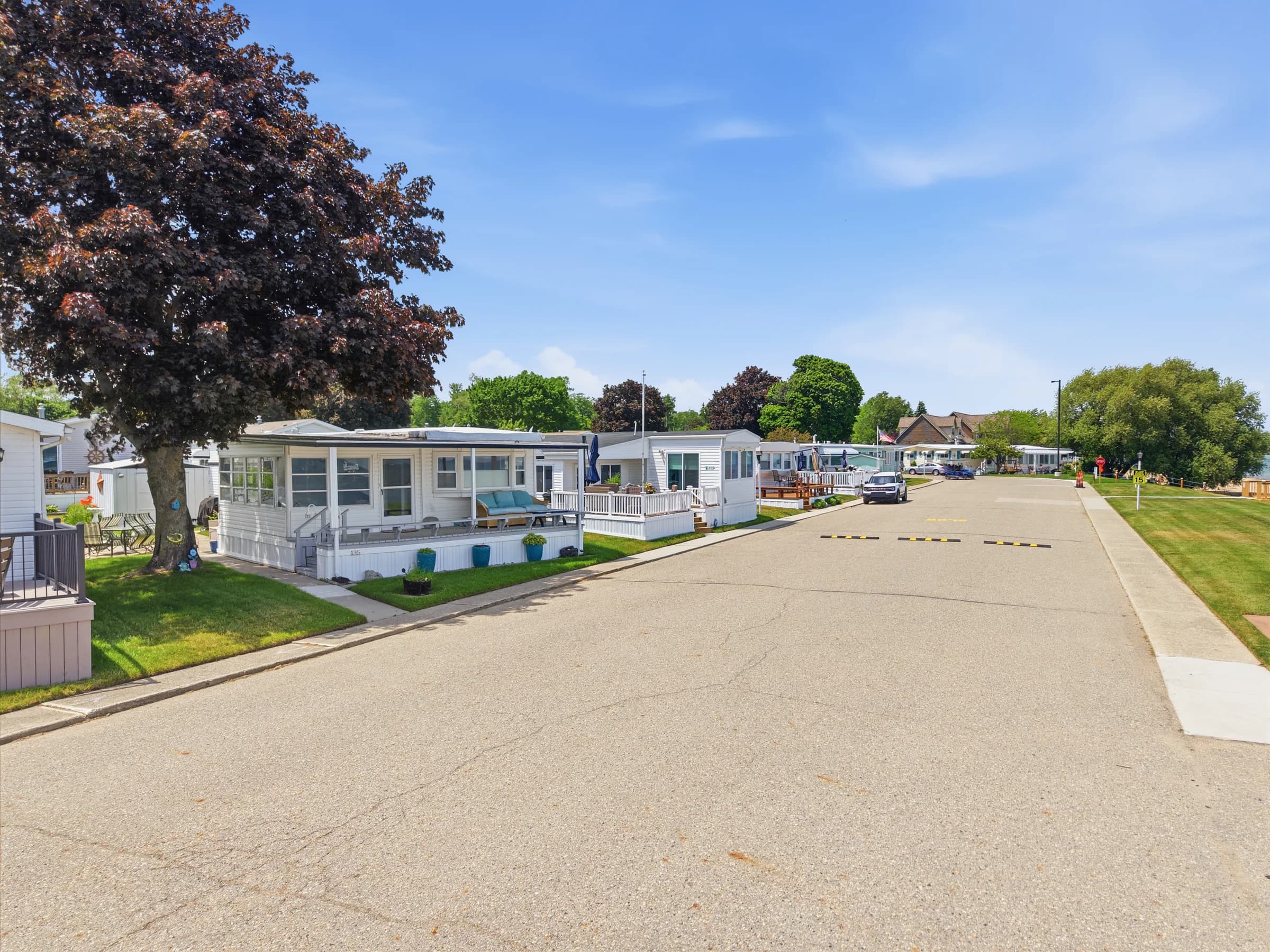 Quiet residential street and well-kept homes at Huron Shores